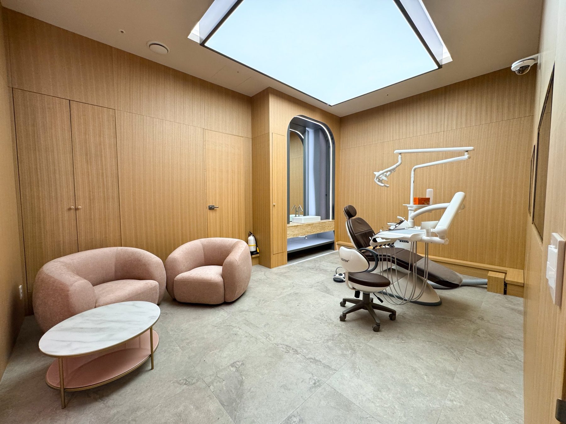 Private treatment room with lounge seating at Heal Dental Hospital